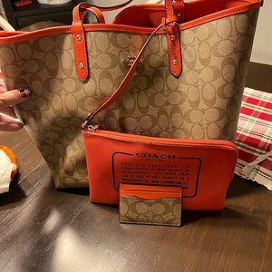 Coach reversible tote with coin purse.